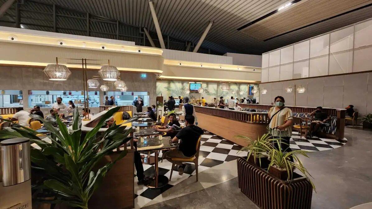 people sitting at tables in a restaurant