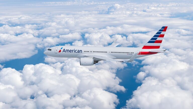 American Airlines plane flying through clouds.