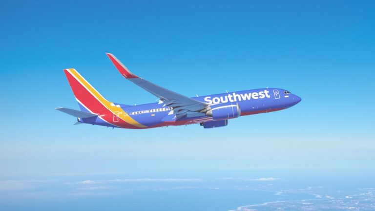 Southwest Airlines plane flying over California coast.