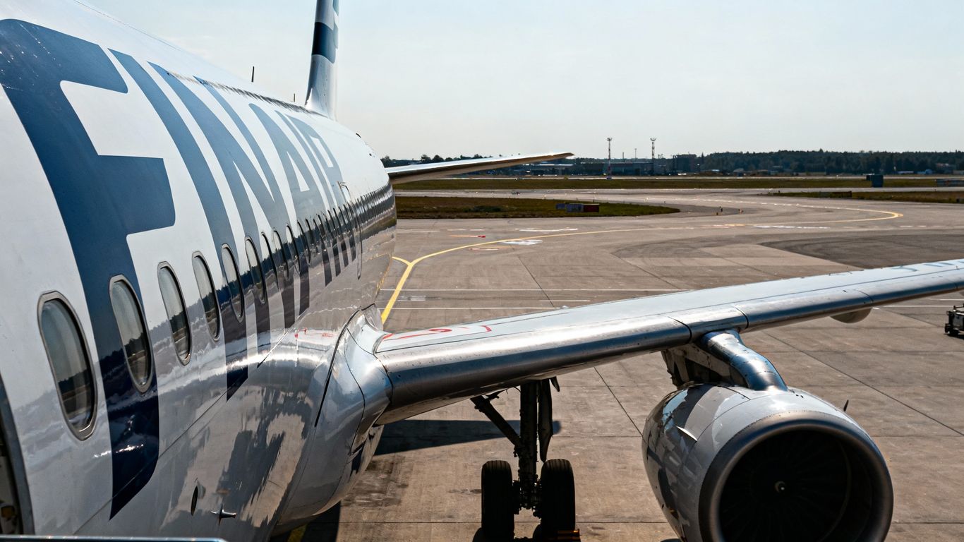 Finnair airplane grounded on tarmac.