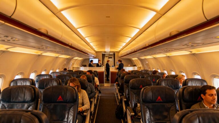 Delta airplane interior with premium seating and check-in.